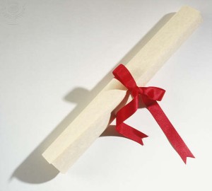 Piece of paper rolled and tied with ribbon